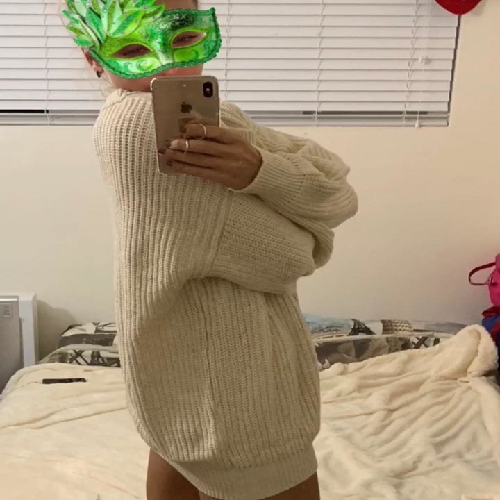 side view of the sweater in white