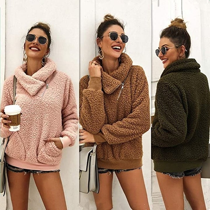 model showing off the sweater in pink, brown, and olive green 