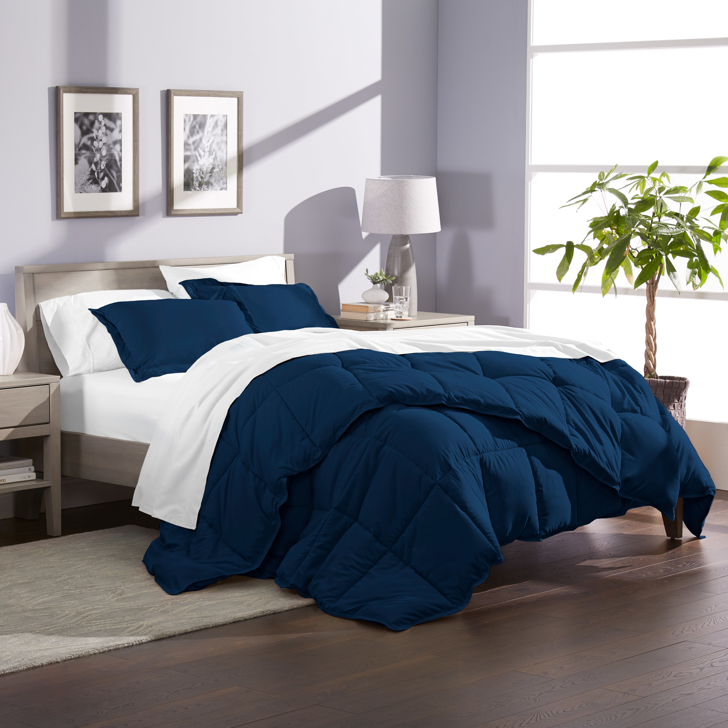 the comforter in navy on a bed