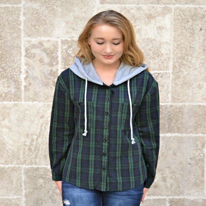 reviewer wearing hoodie in green plaid