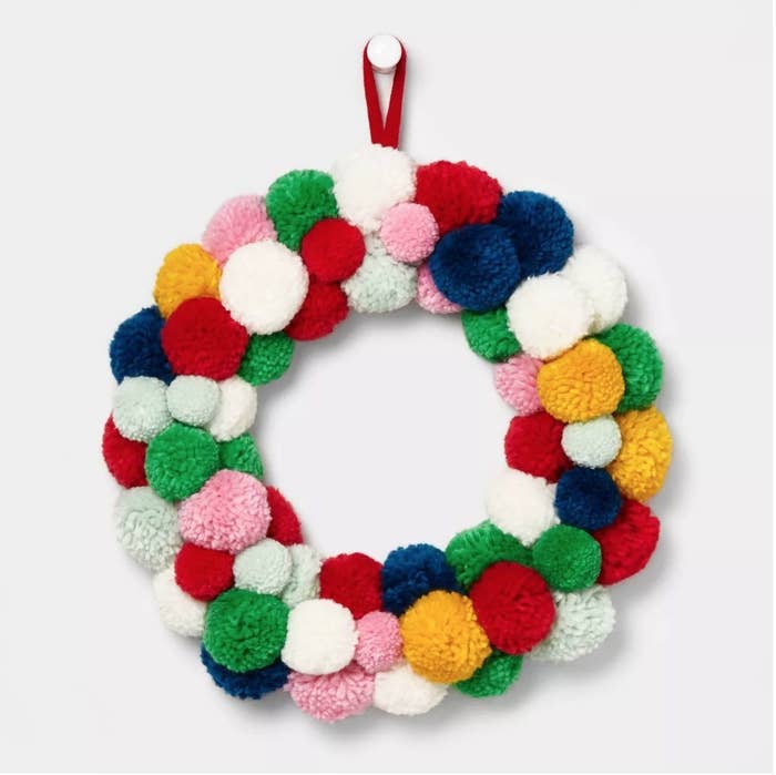 Green, pink, blue, white and yellow pompom wreath