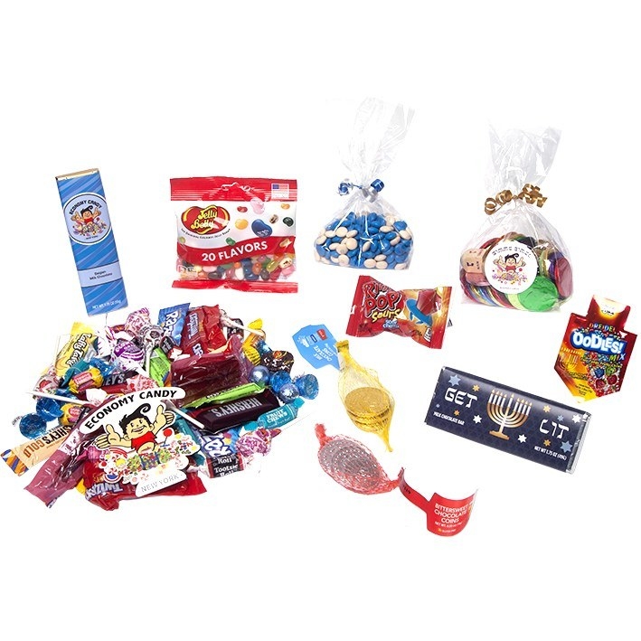 A large pile of small candy, gelt, a Hanukkah-themed chocolate bar, jelly beans, and more