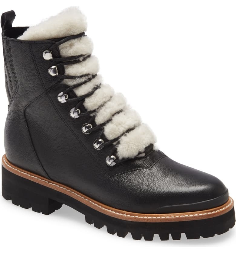 The boots in black with white shearling along the tongue