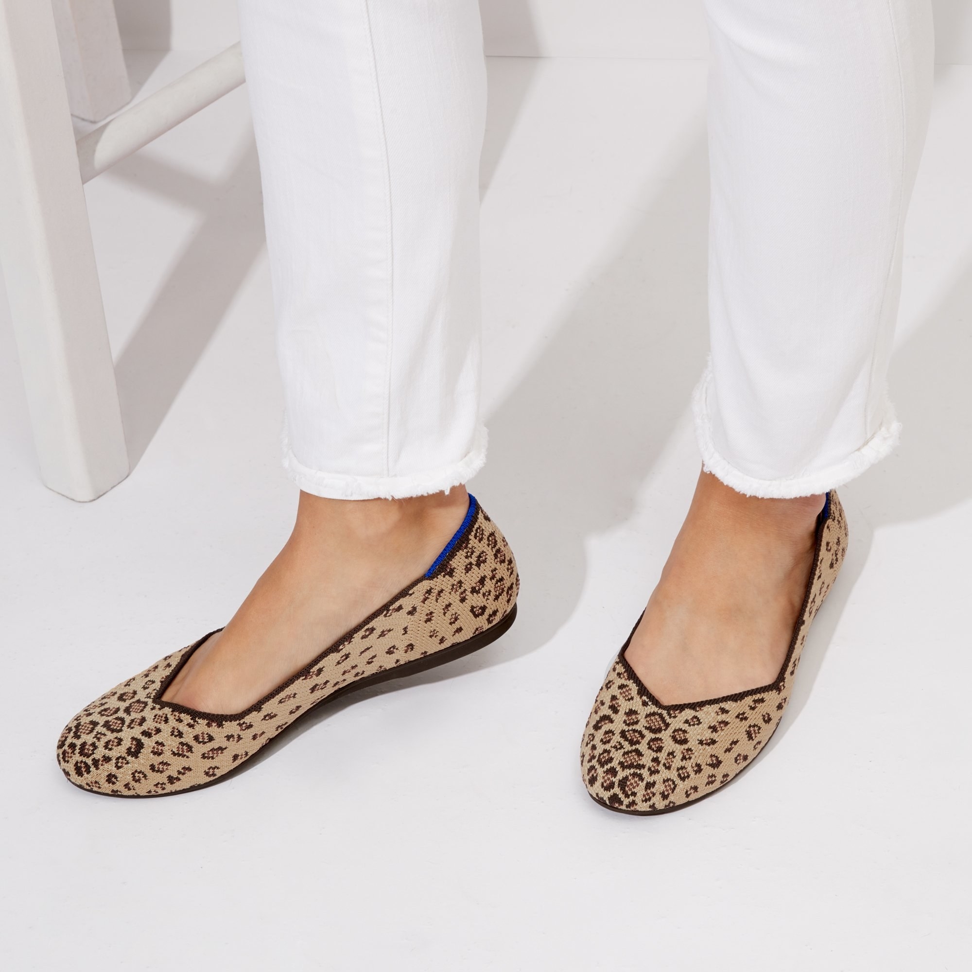 a pair of flats with leopard print 