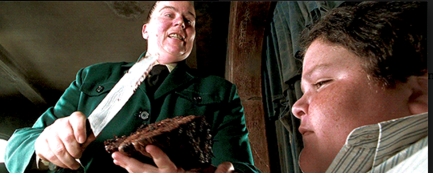 Pam Ferris as Agatha Trunchbull and Jimmy Karz as Bruce Bogtrotter in the movie &quot;Matilda.&quot;