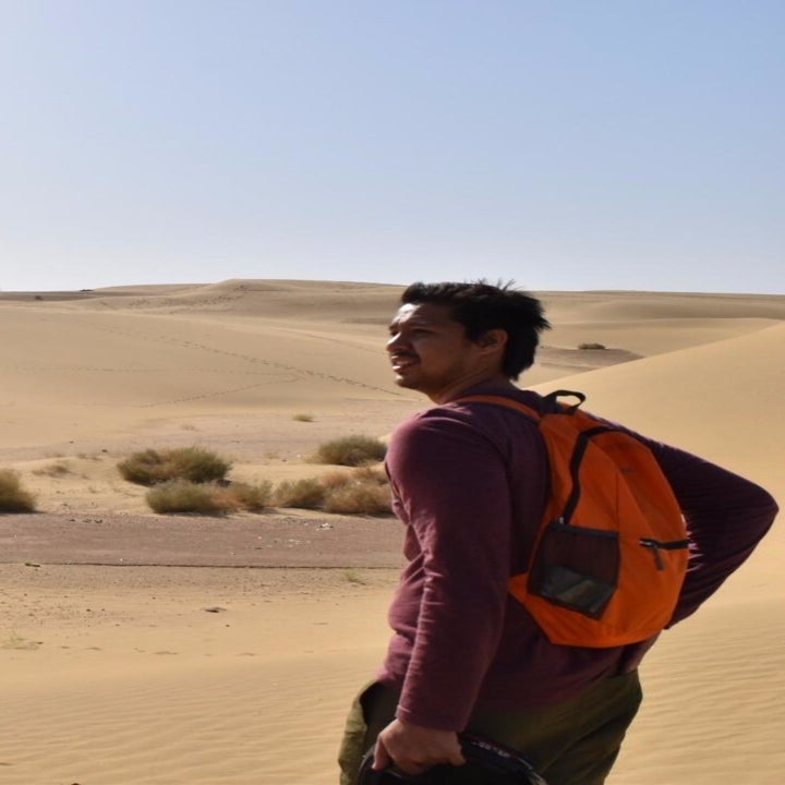 Reviewer wearing orange version in the desert