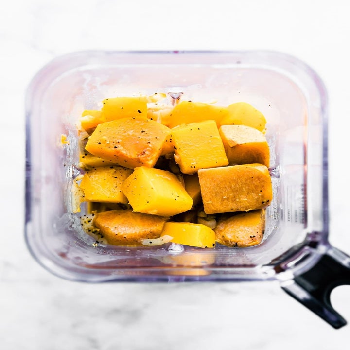 Roasted butternut squash in a blender.