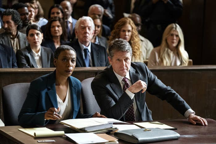 Noma Dumezweni and Hugh Grant in a courtroom scene in The Undoing