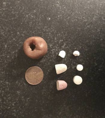 Reviewer photo of the pill pocket next to pills and a penny for size reference