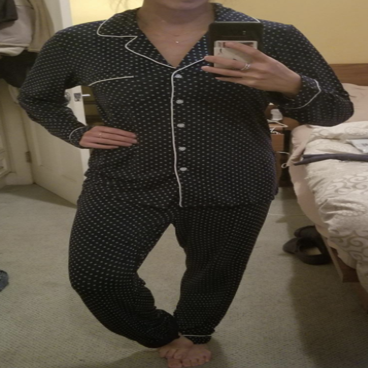 Reviewer wearing polka dot pajama set