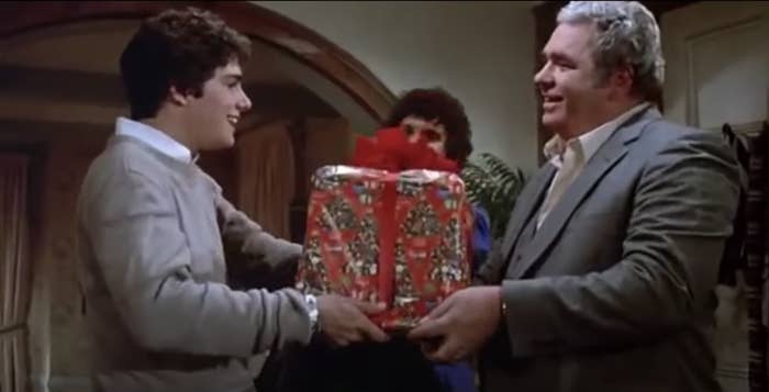 The father in Gremlins gives his son, Billy, a wrapped Christmas gift