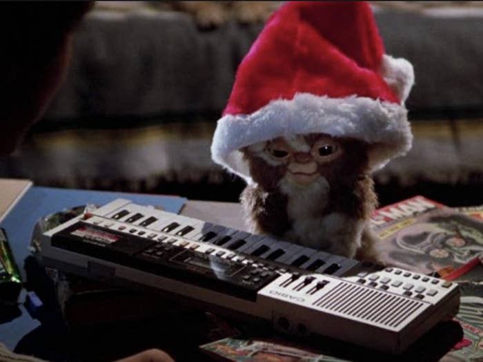 Gizmo the Gremlin wearing a Santa hat