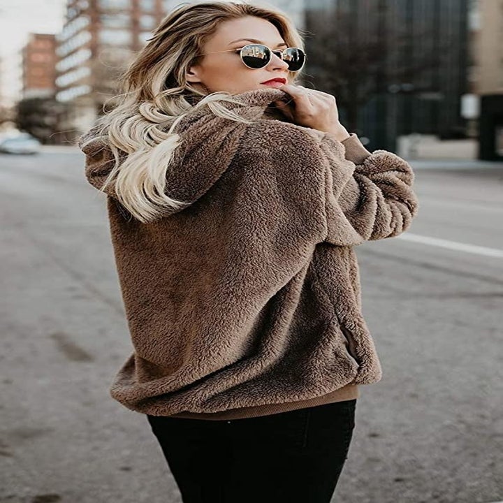 model wearing brown sweater