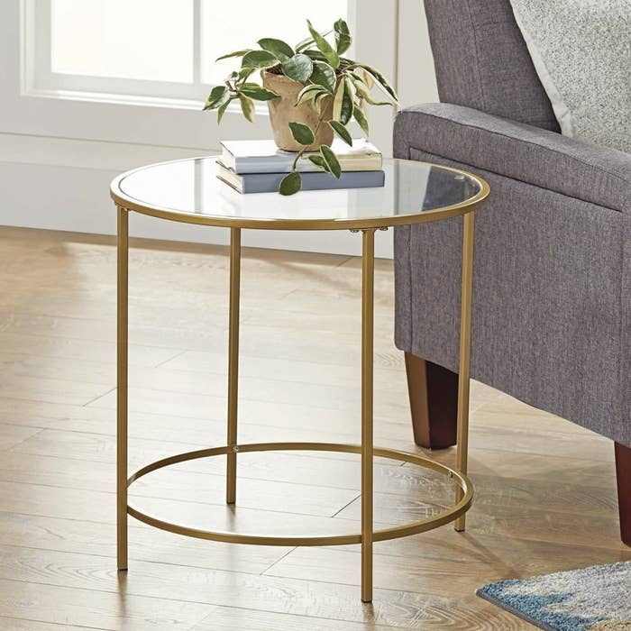 Round gold-finished side table