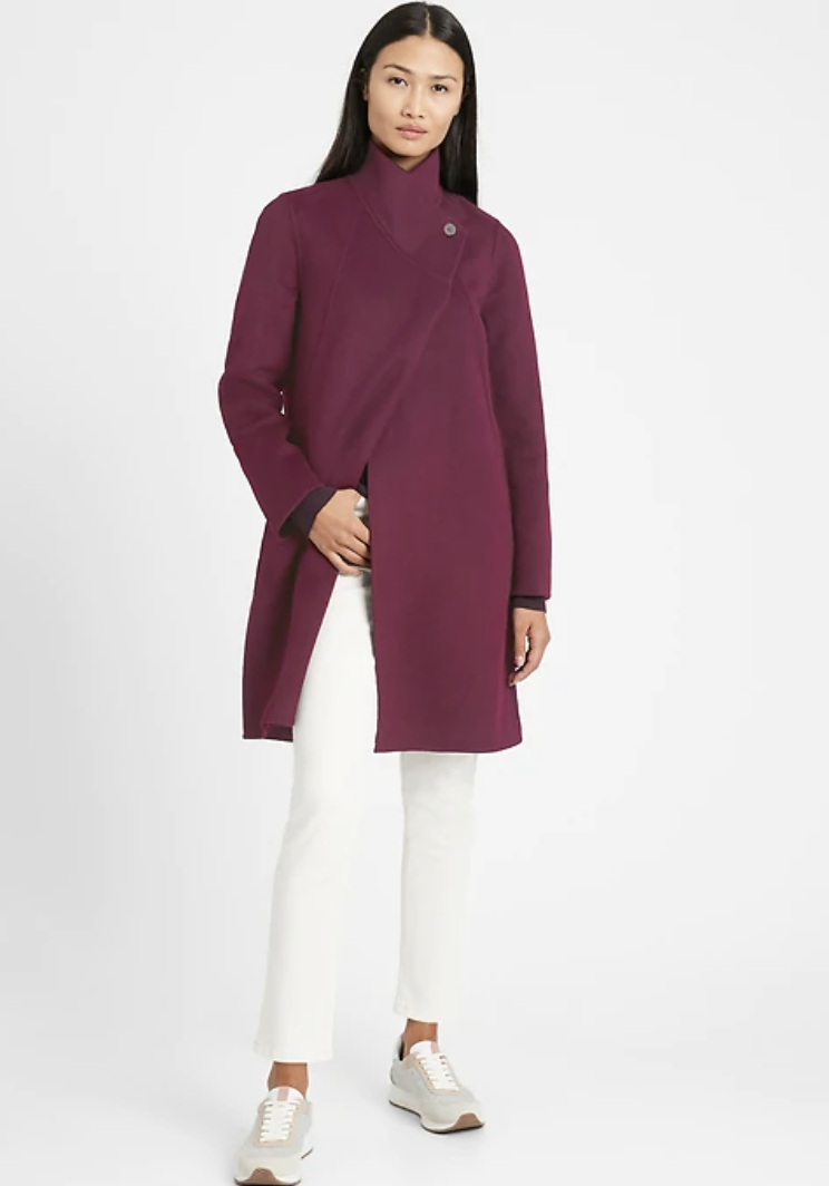 Model wears cocoon coat in sour cherry red