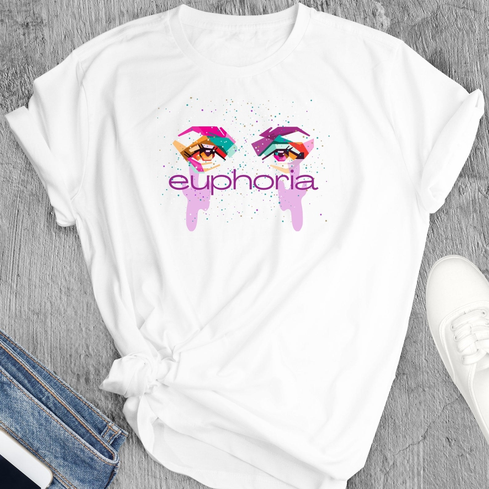 the euphoria inspired tshirt next to a pair of sneakers and jeans