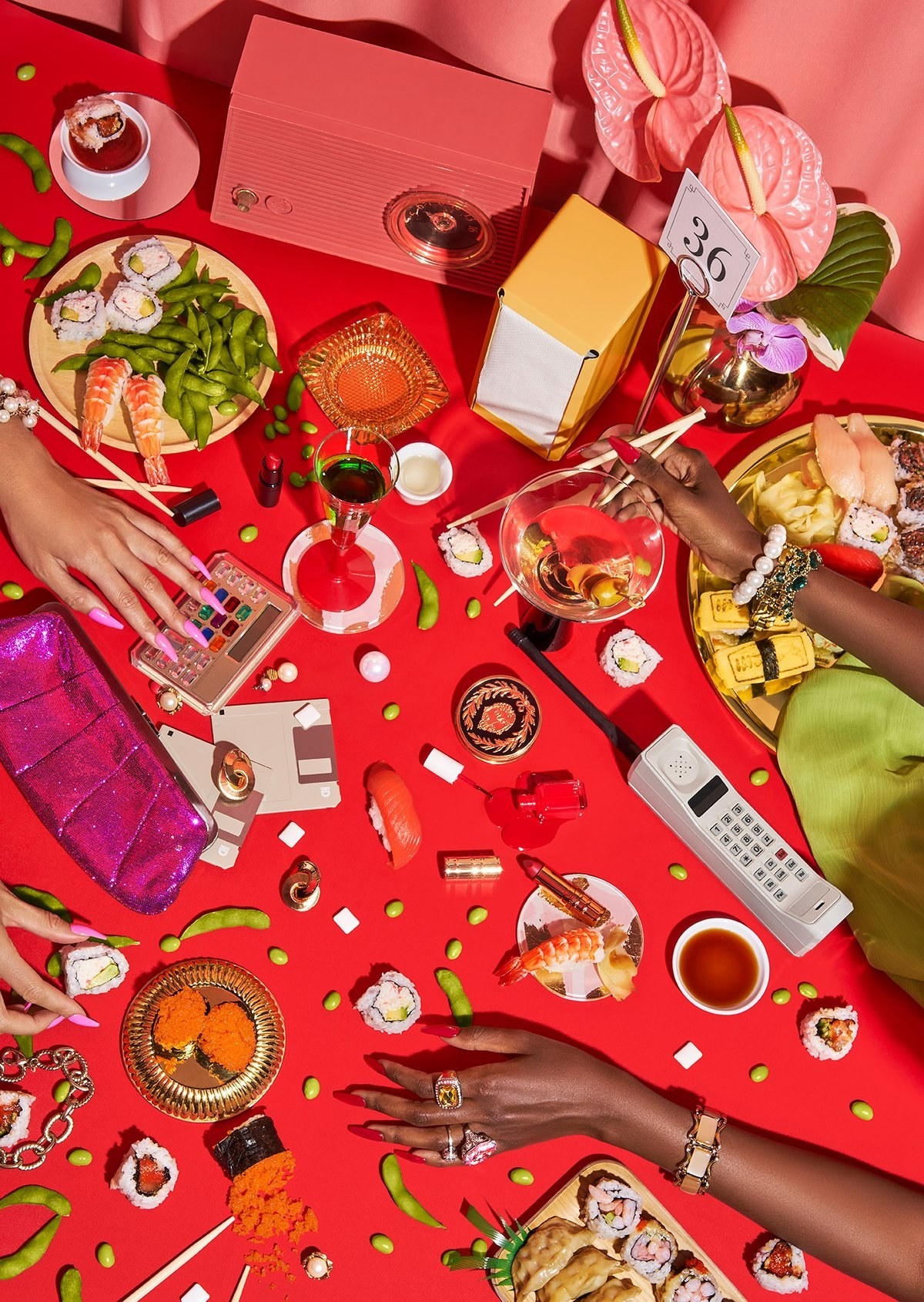 the puzzle featuring three hands, sushi, trinkets, and accessories on a bright red background