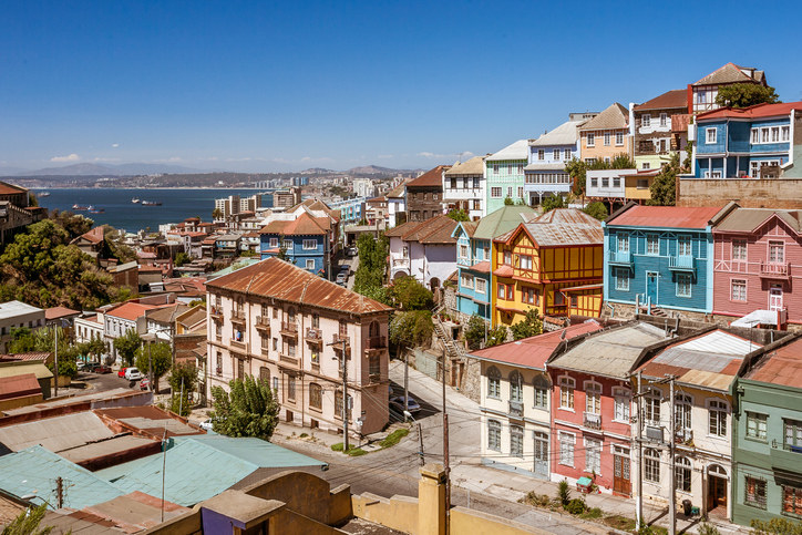 A collection of colorful buildings set on narrow streets leading down to the water