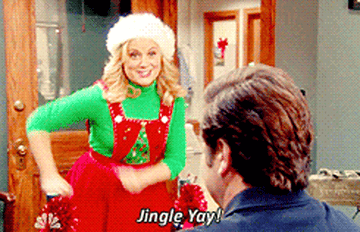 Leslie Knope yelling &quot;jingle yay!&quot; while dancing in a Christmas themed outfit