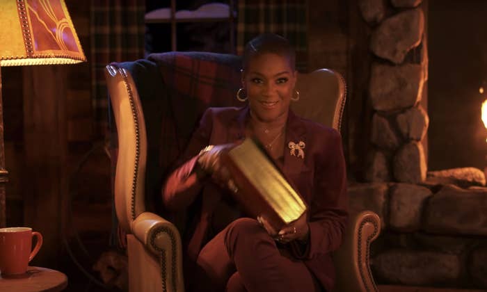 Tiffany Haddish holding a book