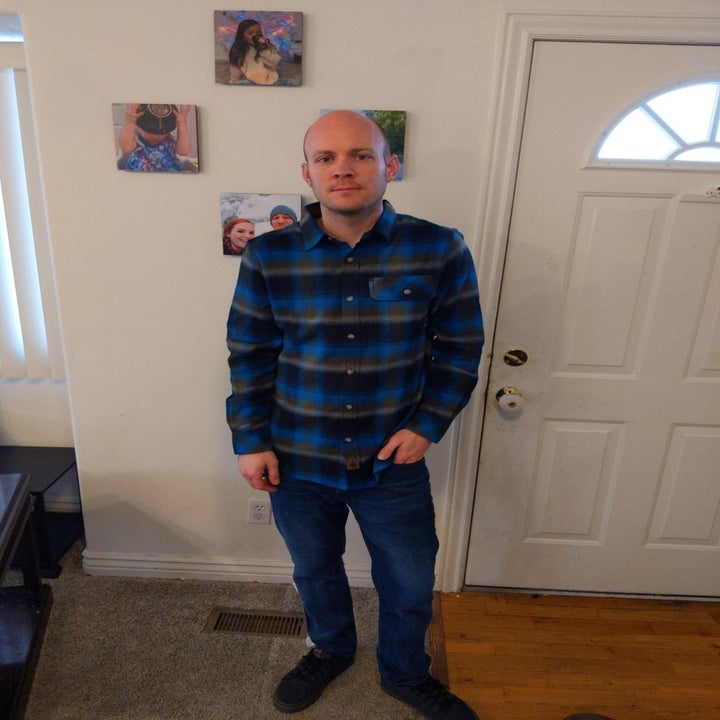 Reviewer wearing the plaid shirt in blue and black