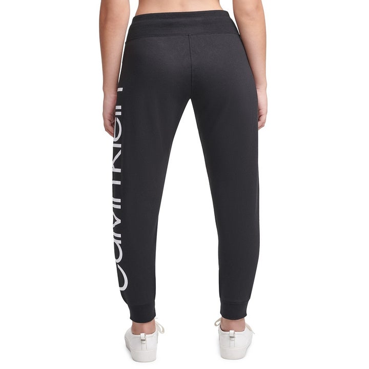 Back view of the same model wearing the joggers in black