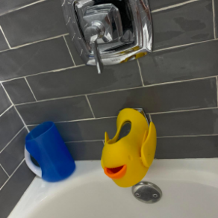 A different reviewer showing the duck from the top, where it is open so you can adjust the faucet for baths and showers 