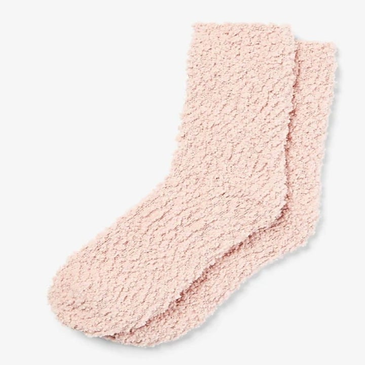 A pair of light pink cozy socks 