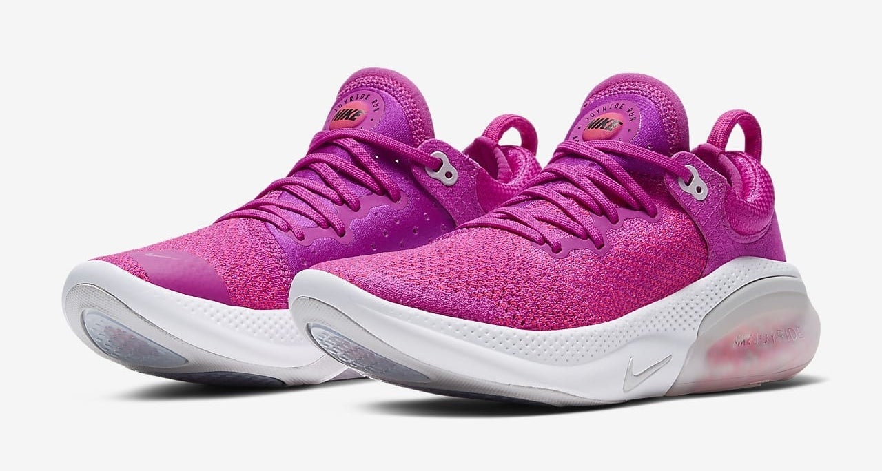 Magenta Nike Joyride Run Flyknit sneakers with tiny foam beads for cushioning under the heel