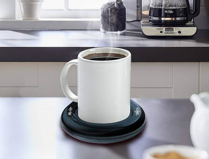 mug of coffee on the drink warmer