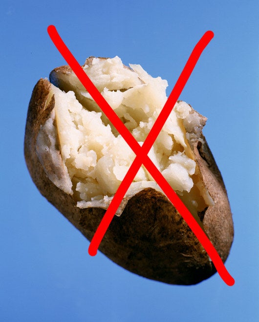 A baked potato crossed out with an X