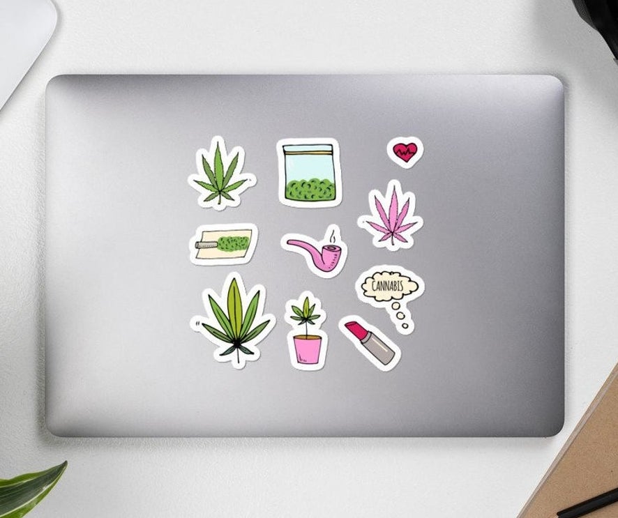 Cannabis-themed stickers on a laptop