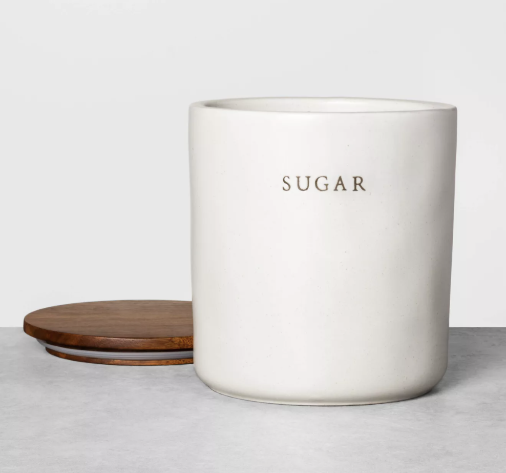 white ceramic jar labeled &quot;sugar&quot; with wood top