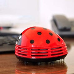 mini ladybug vacuum on a desk
