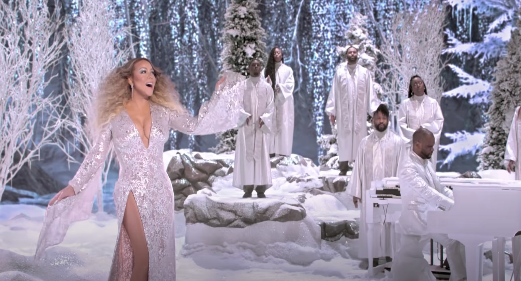 Mariah Carey singing in a forest