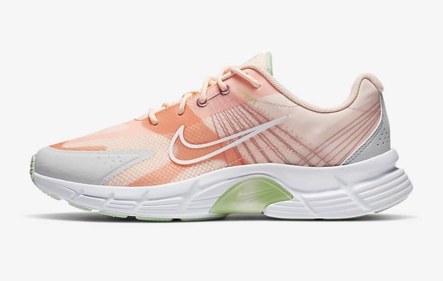 Nike Alphina 5000 running shoe with a pink upper and white detailing on the bottom