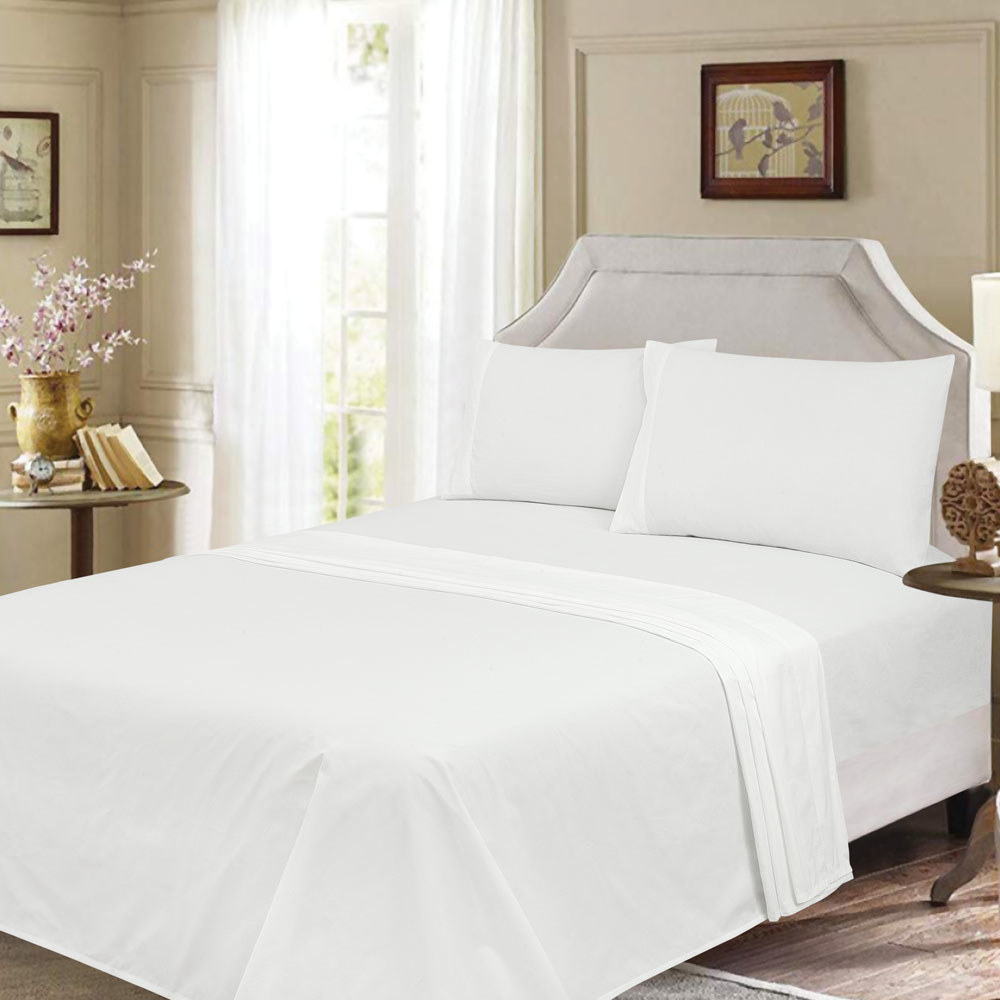 white sheets on a bed