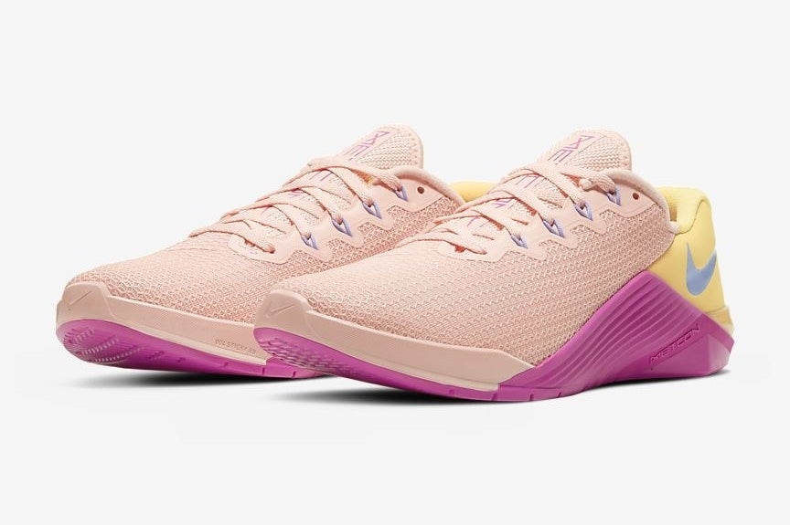 Pair of blush and dark pink Nike Metacon 5 training sneakers