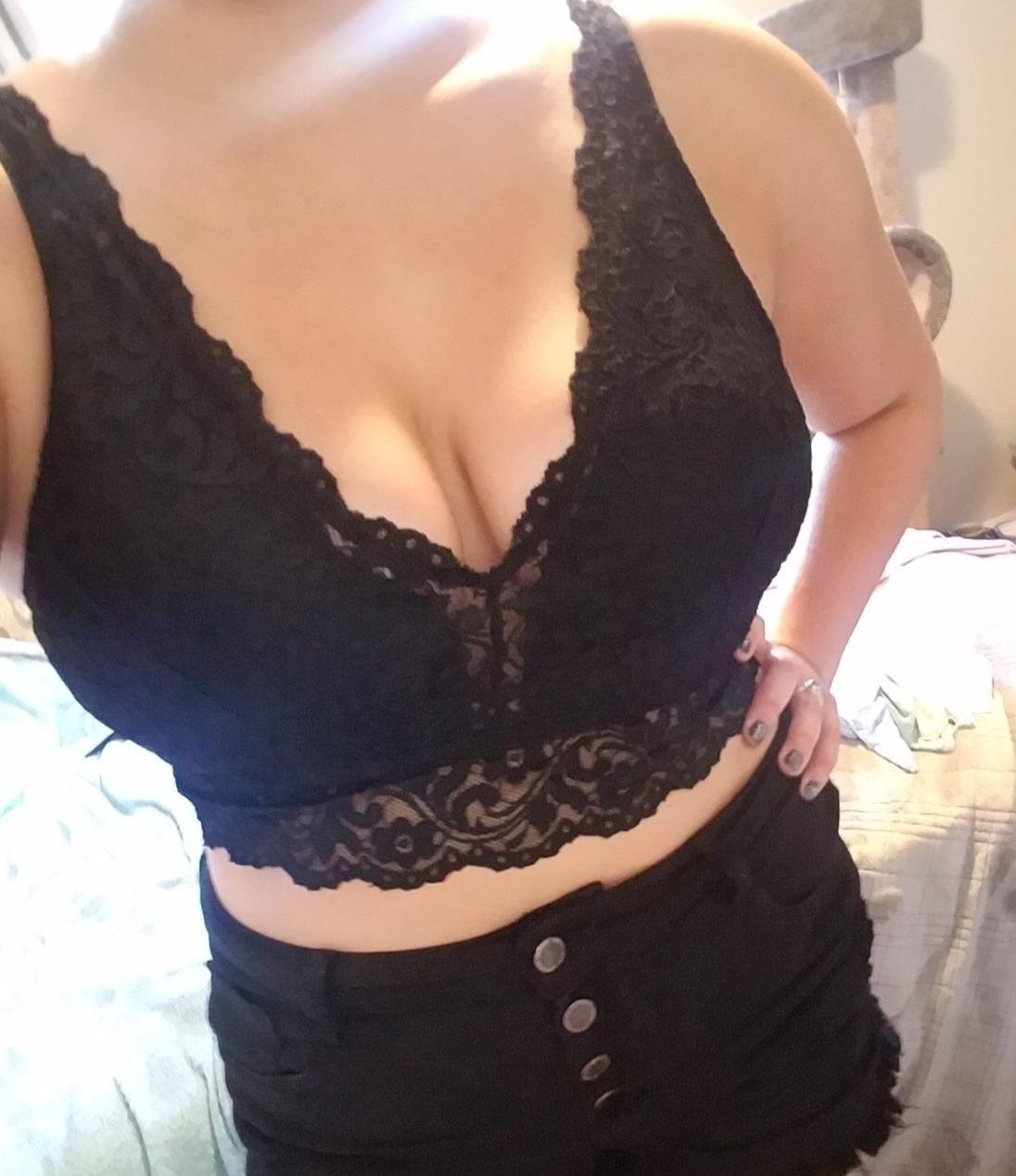 Reviewer wearing the deep-v lacy bralette in black