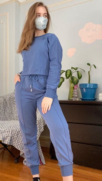 Reviewer wearing blue set