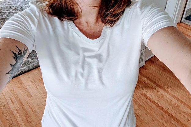 a reviewer wearing the shirt in white