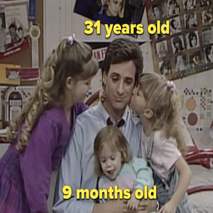 Danny hugging his three daughters in "Full House"