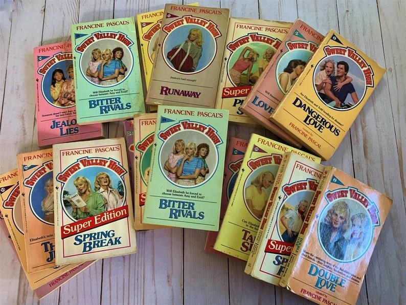 A stack of Sweet Valley High books on a wooden table