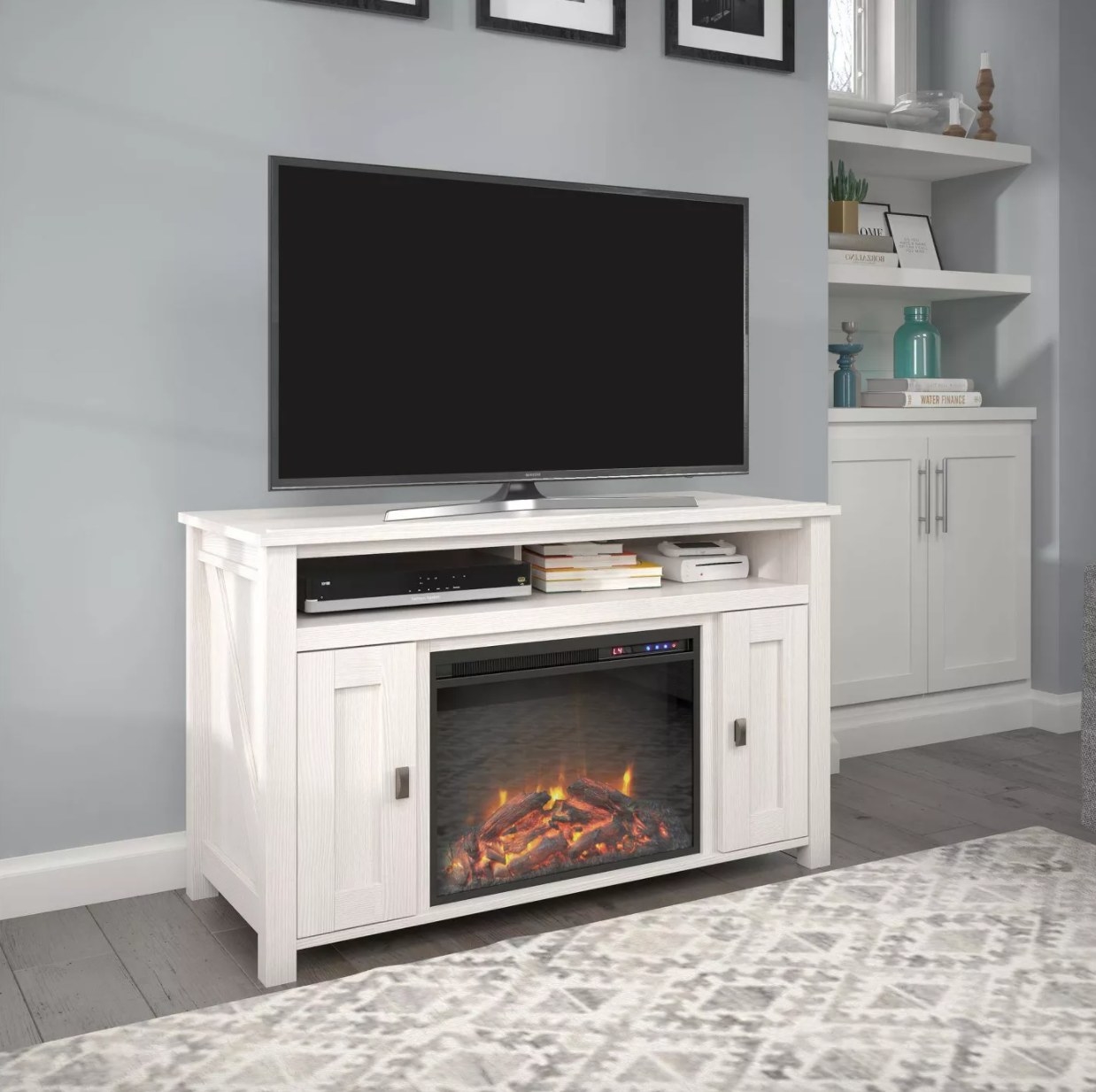 A white TV stand with electric fireplace and heater and storage cabinets