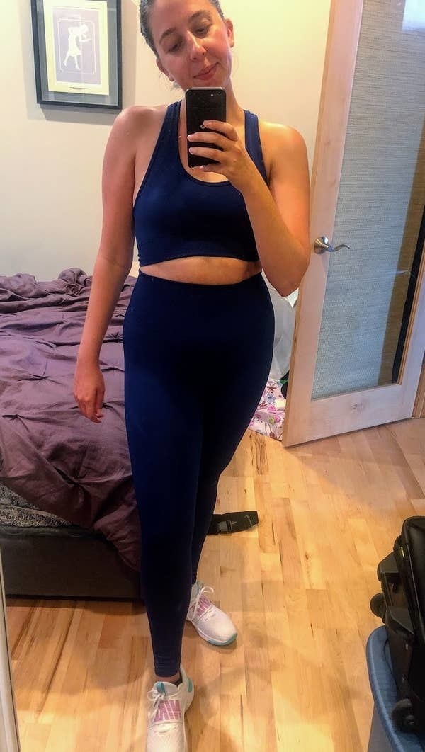 BuzzFeed writer Abby Kass wearing the seamless bra and leggings set in black