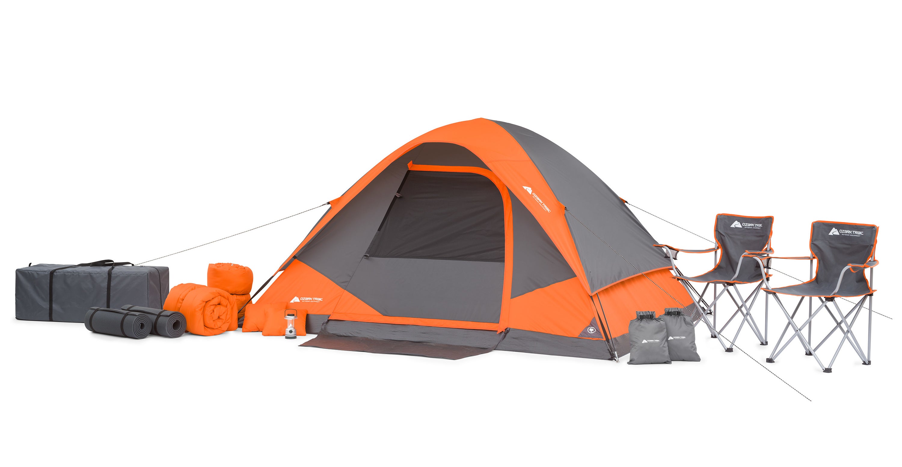 an orange tent, two chairs, and camping accessories