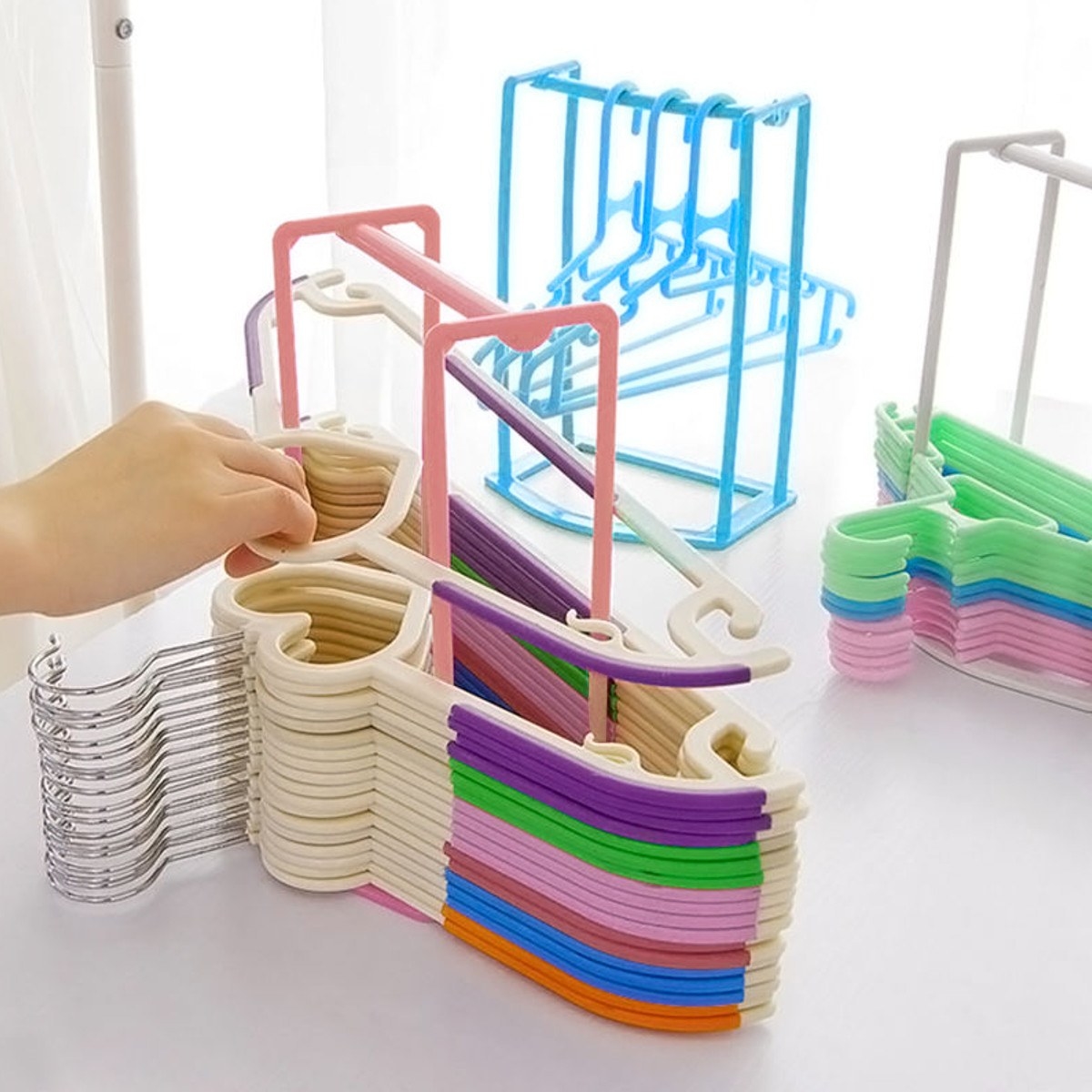 The stacker with hangers stacked on top