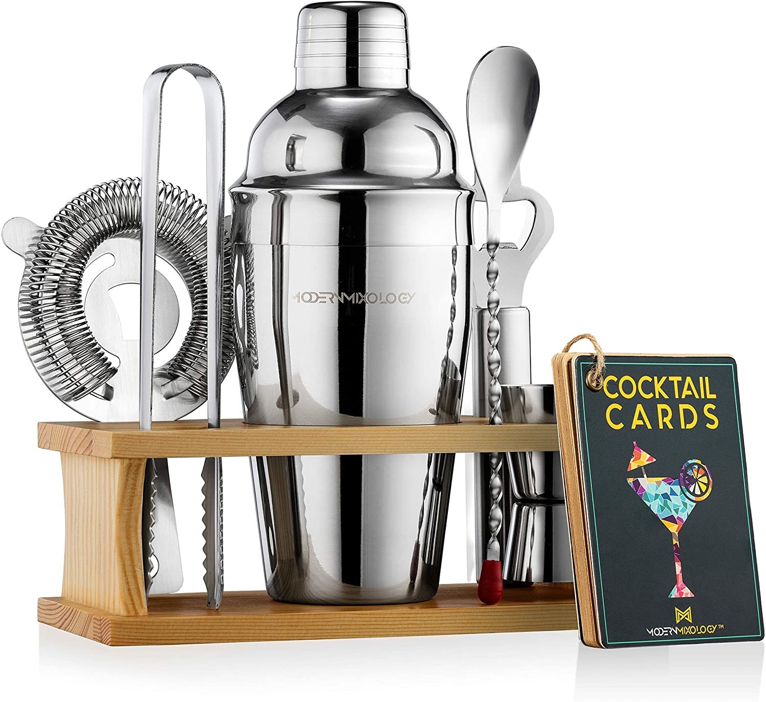 mixology set with shaker and tools in wood stand, cocktail cards