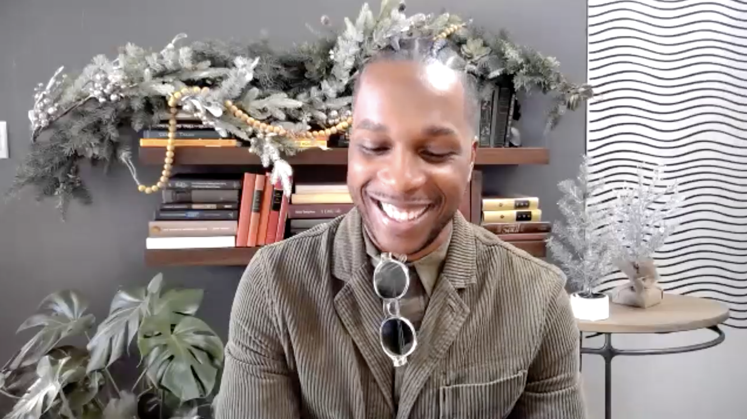 Leslie Odom Jr. smiles during an interview