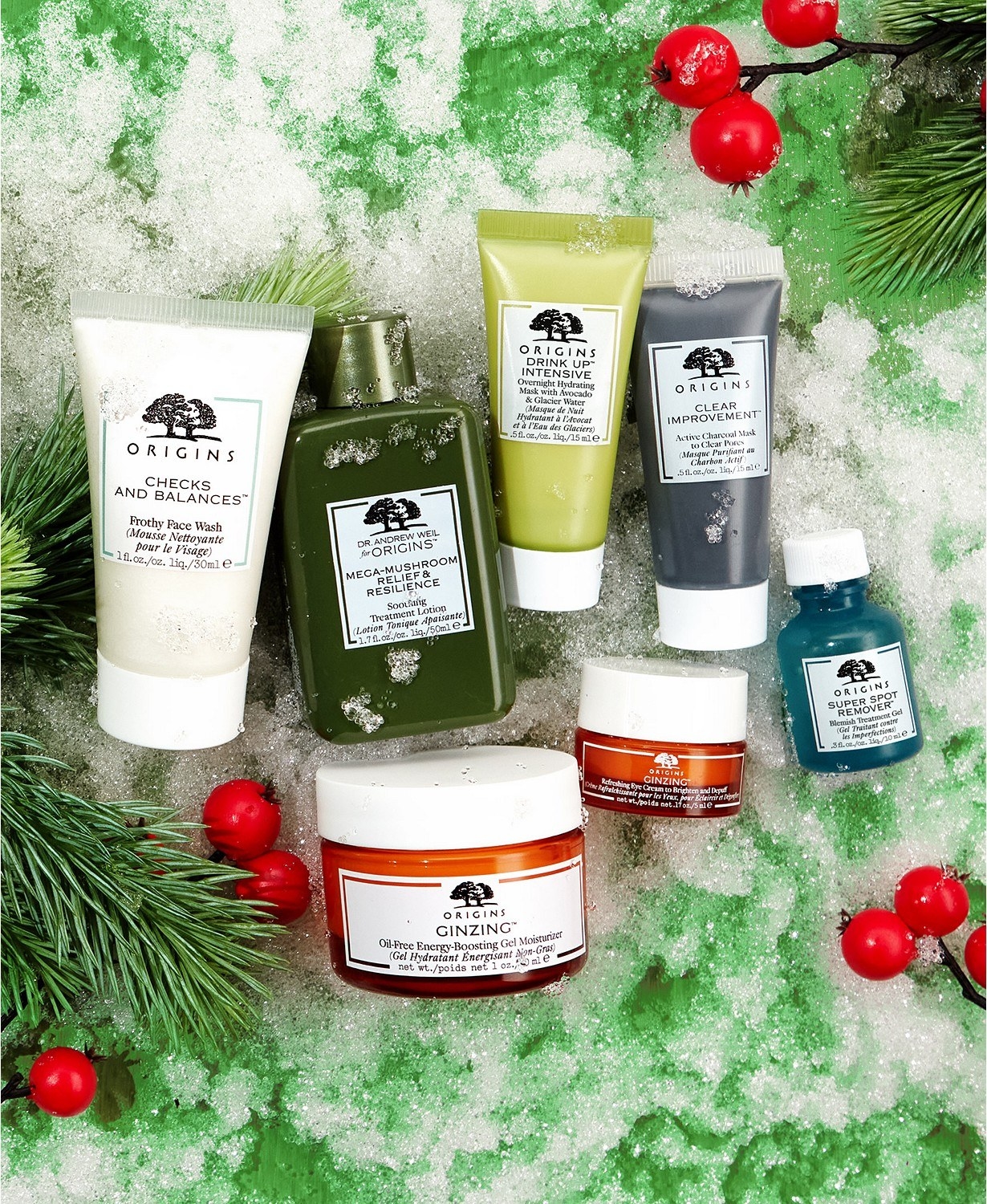 Seven bottles of Origins skin care products on a holiday background